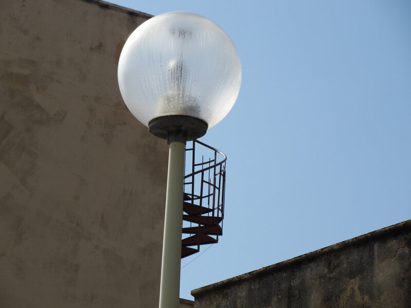 Street lamp with spiral staircase