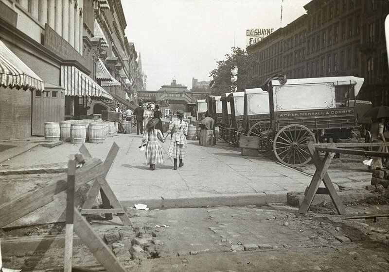 Street scene with children and wagons