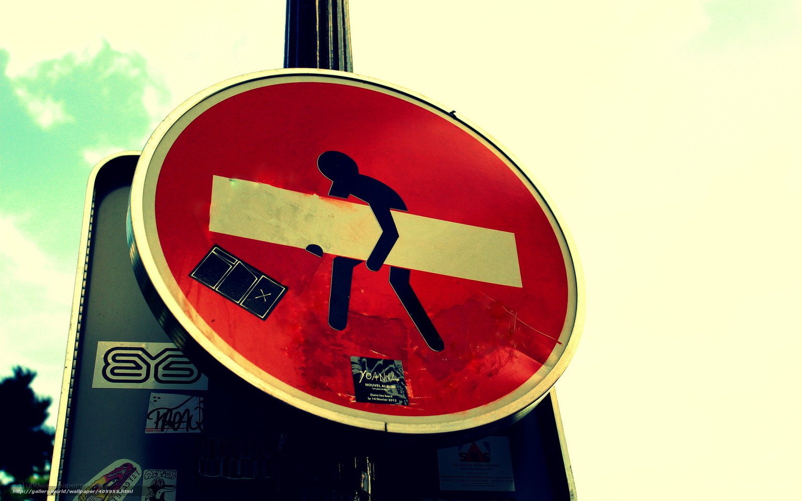 street sign with stickers