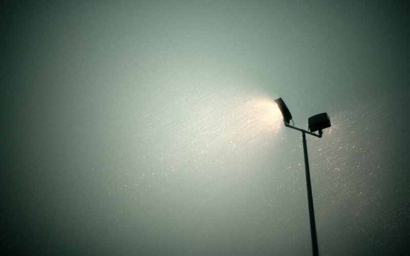 Streetlight in foggy night