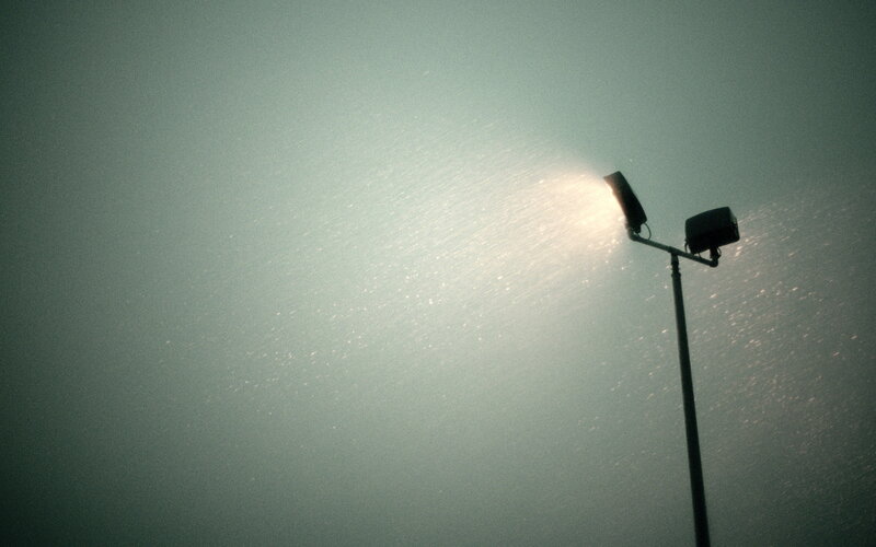 Streetlight in foggy night