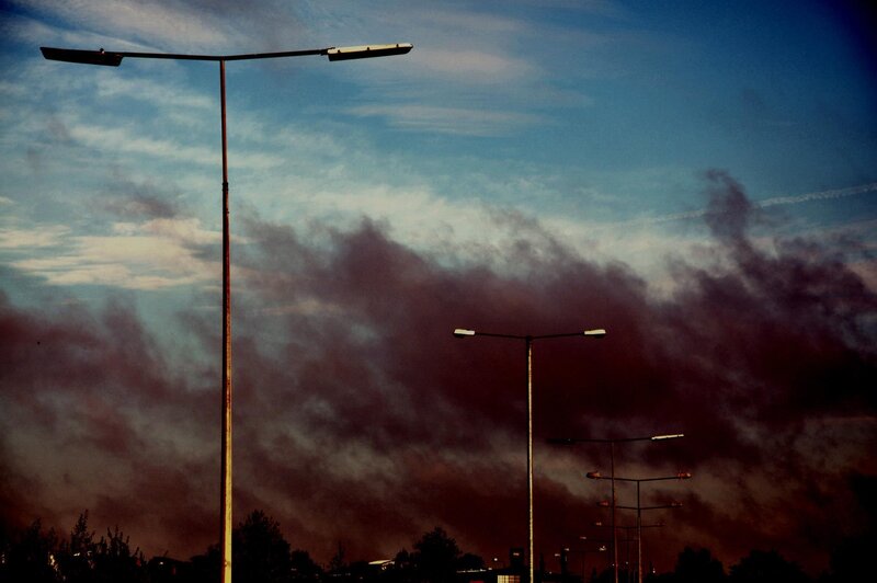 Streetlights against a stormy sky