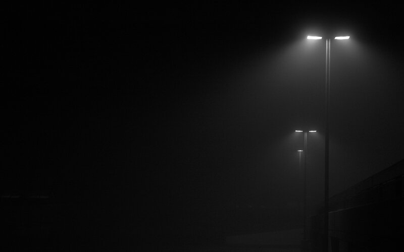 Streetlights in foggy night