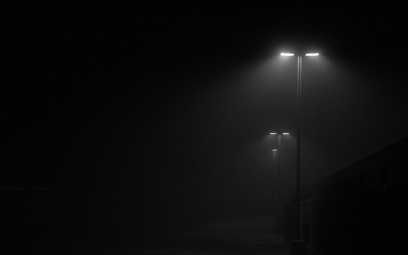 Streetlights in foggy night