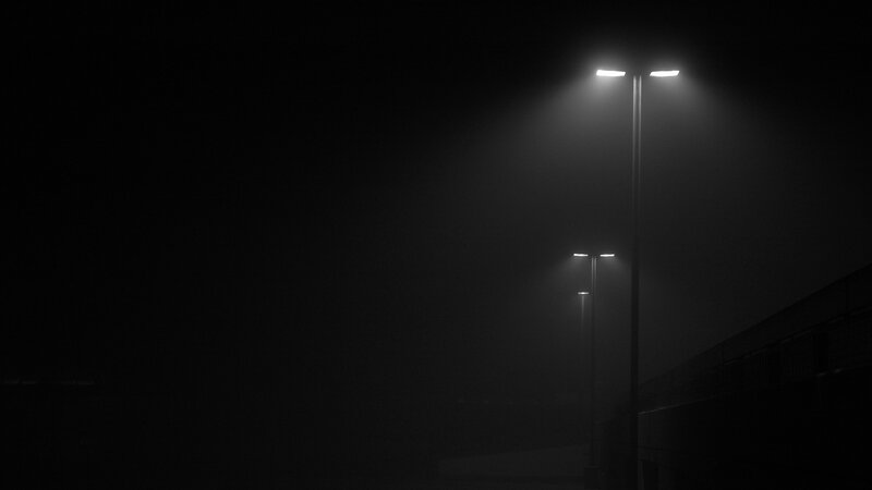 Streetlights in foggy night