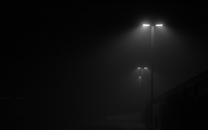 Streetlights in foggy night