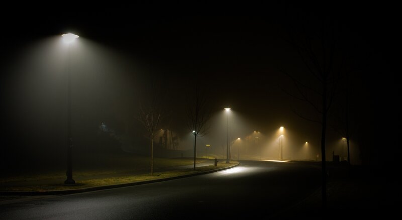 Streetlights on Foggy Road