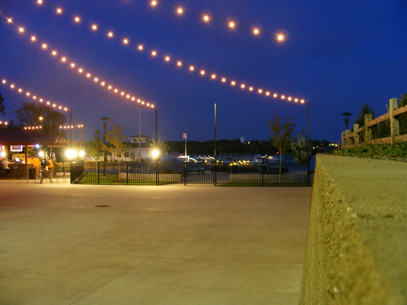 String lights over a waterfront patio