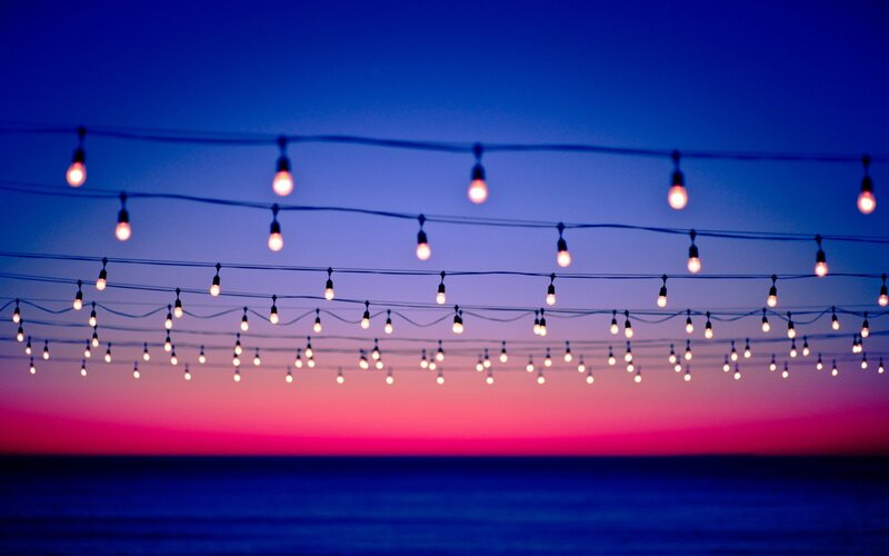 String of Lights over Ocean — Blue, Serene, Sunset, Photograph