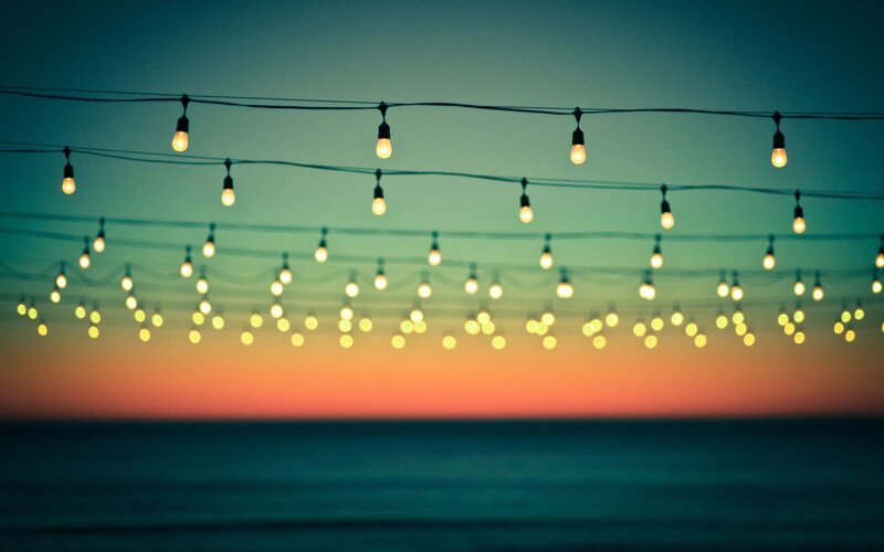 String of Lights over Ocean — Blue