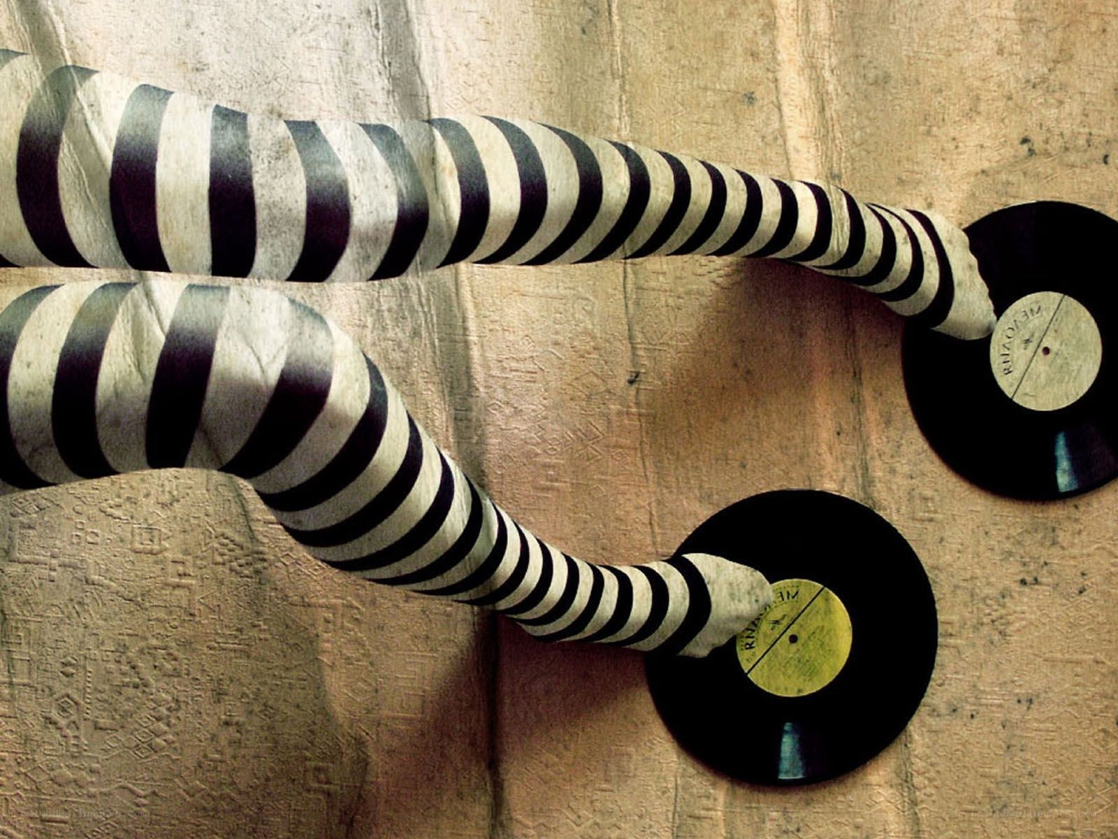 striped arms holding records