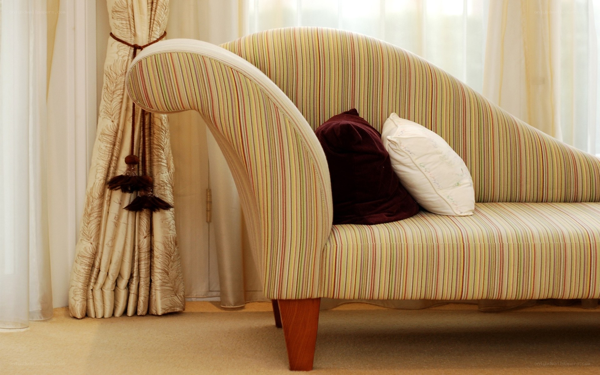 Striped chaise lounge with pillows