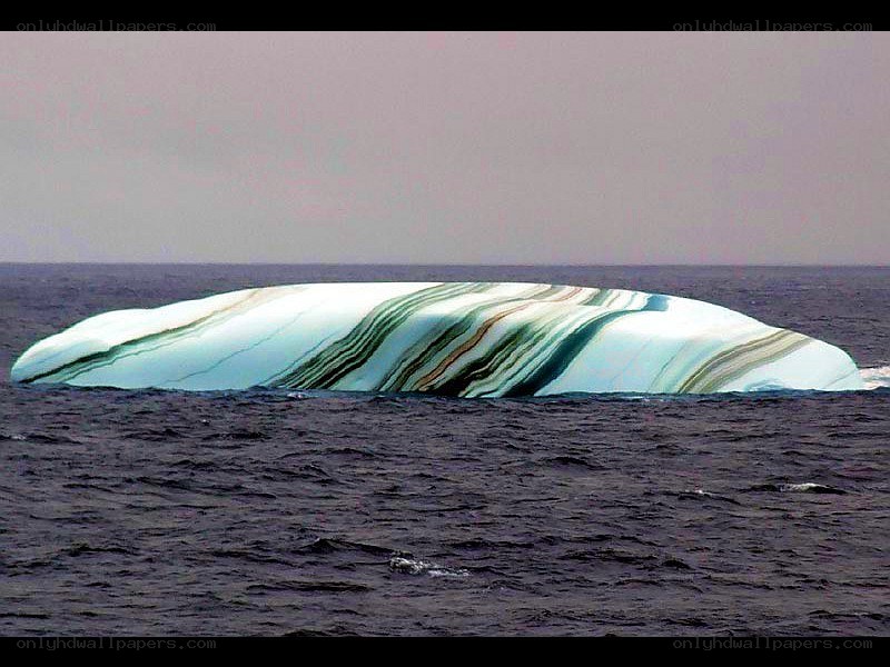 Striped iceberg in ocean