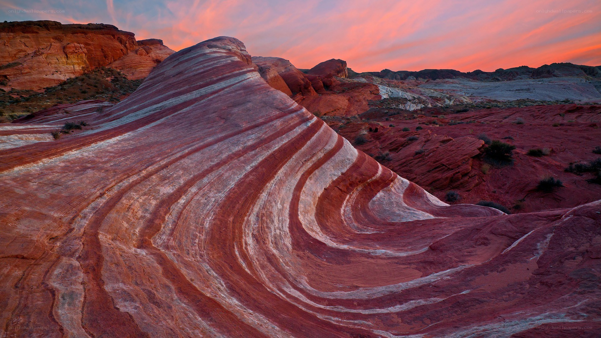 Striped rock formations at sunset