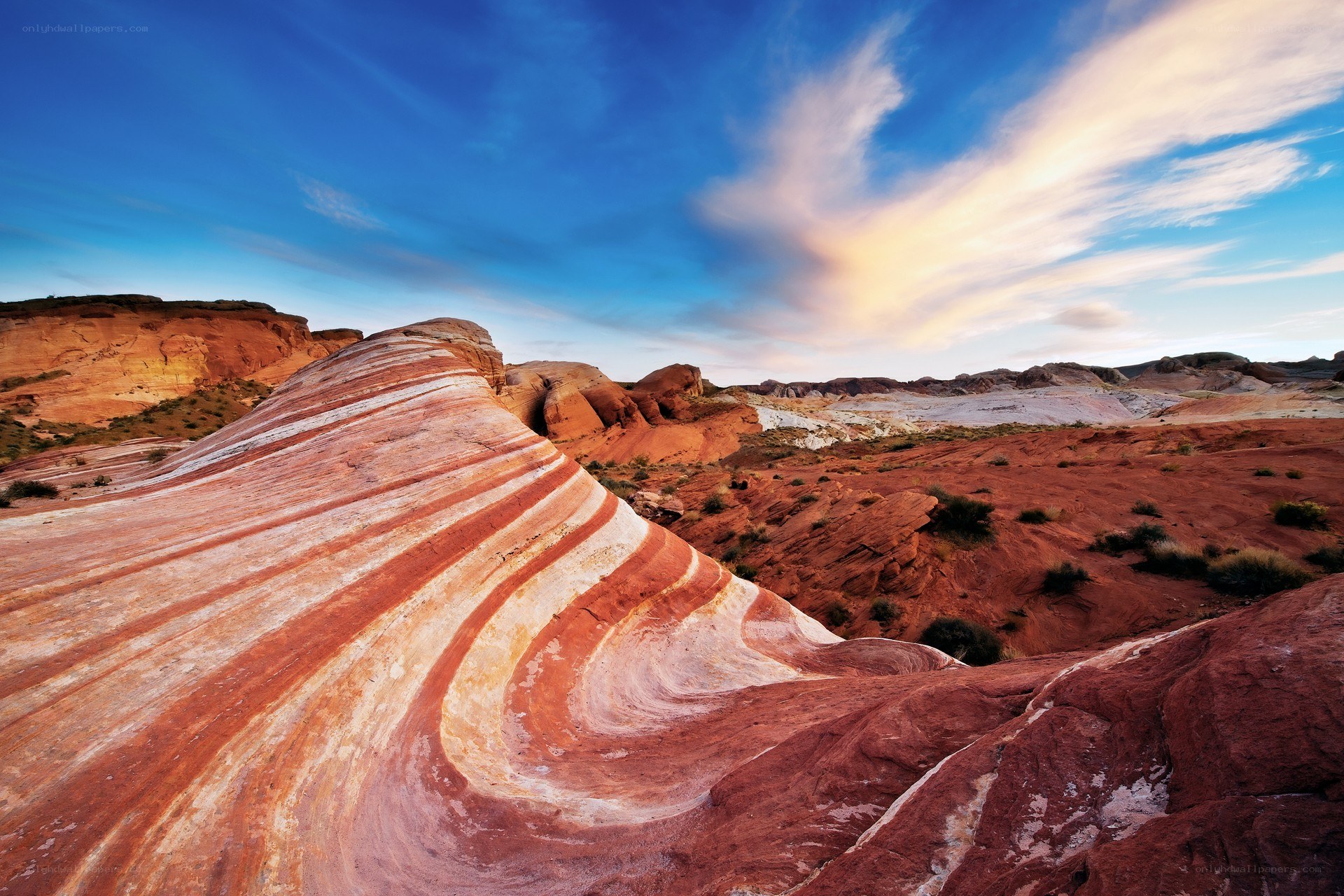 Striped rock formations in desert