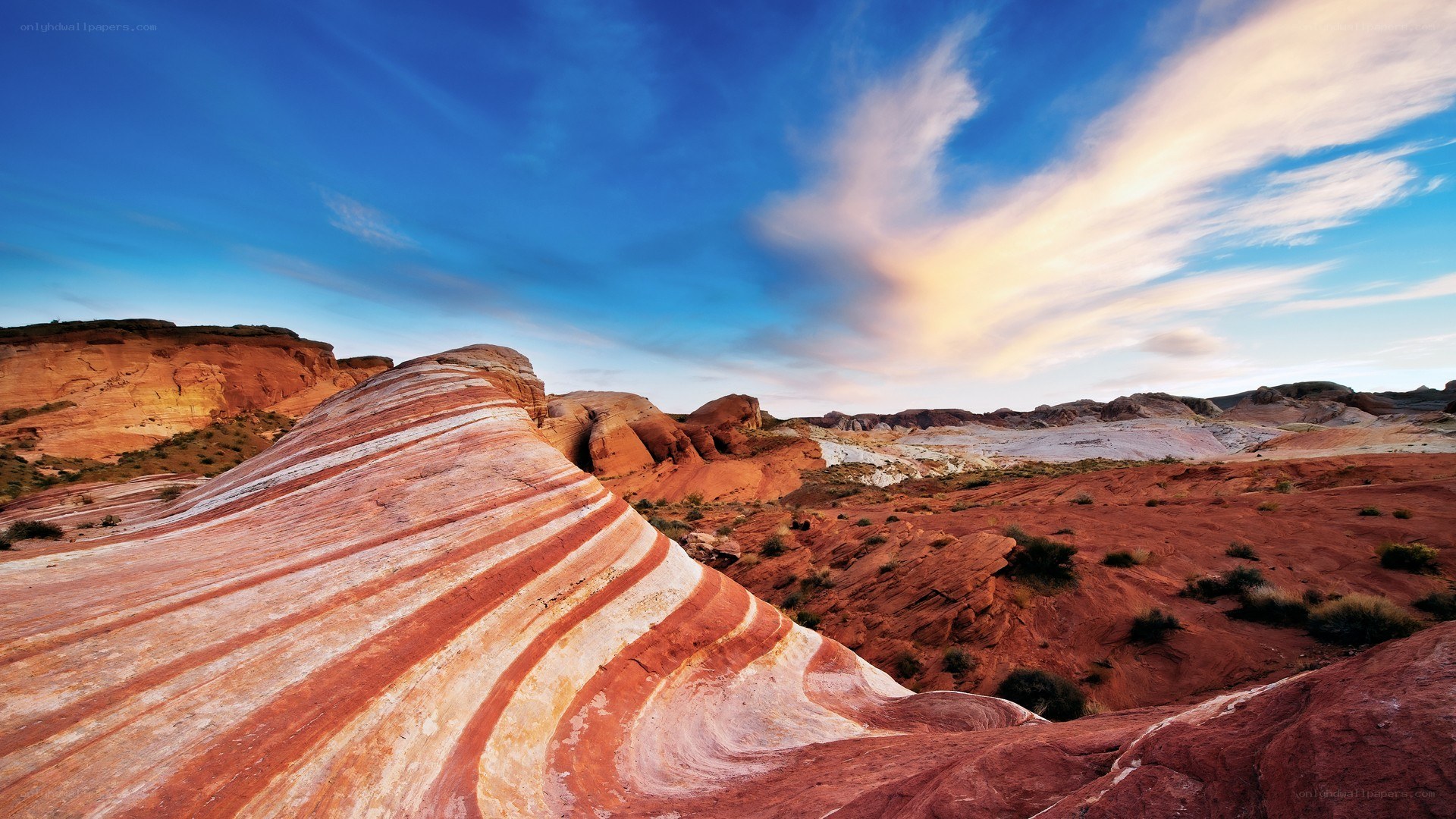 Striped rock formations in desert
