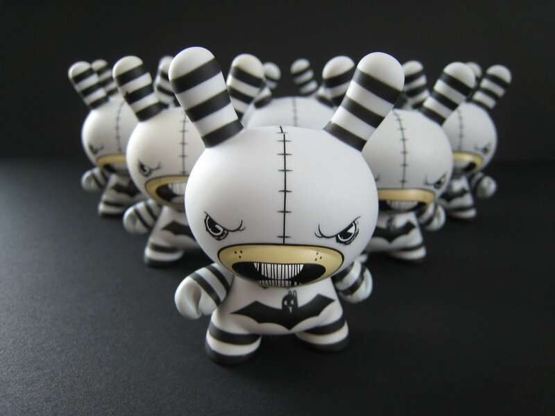 Striped toy figures in a group