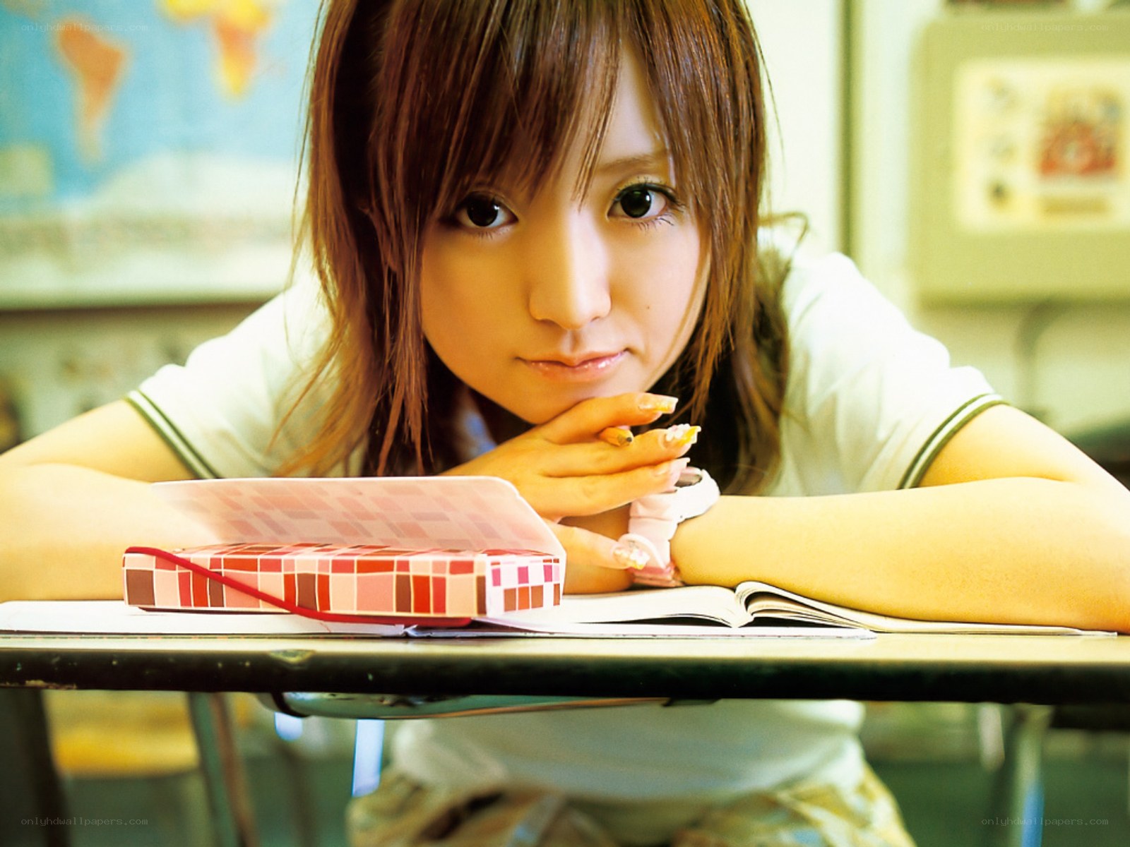 student at a desk in classroom
