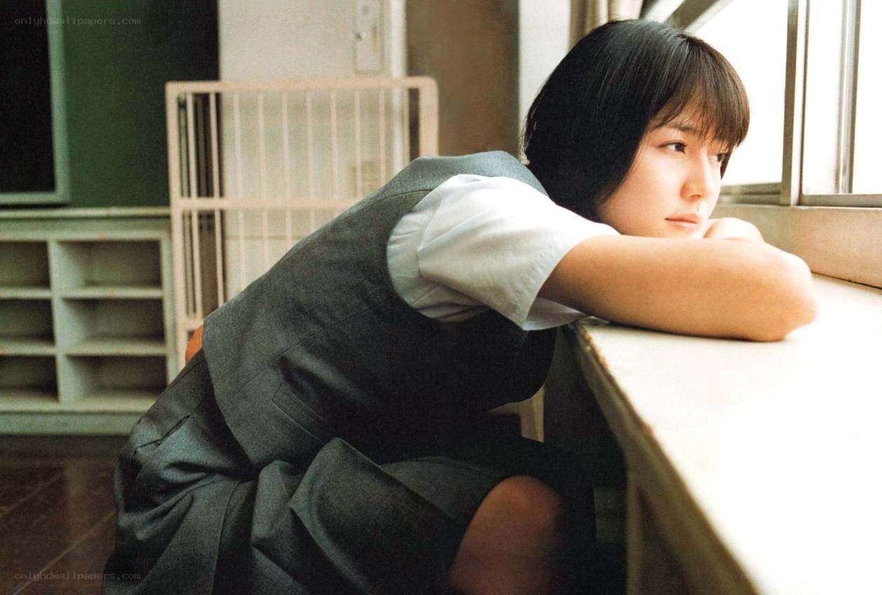 student at classroom window