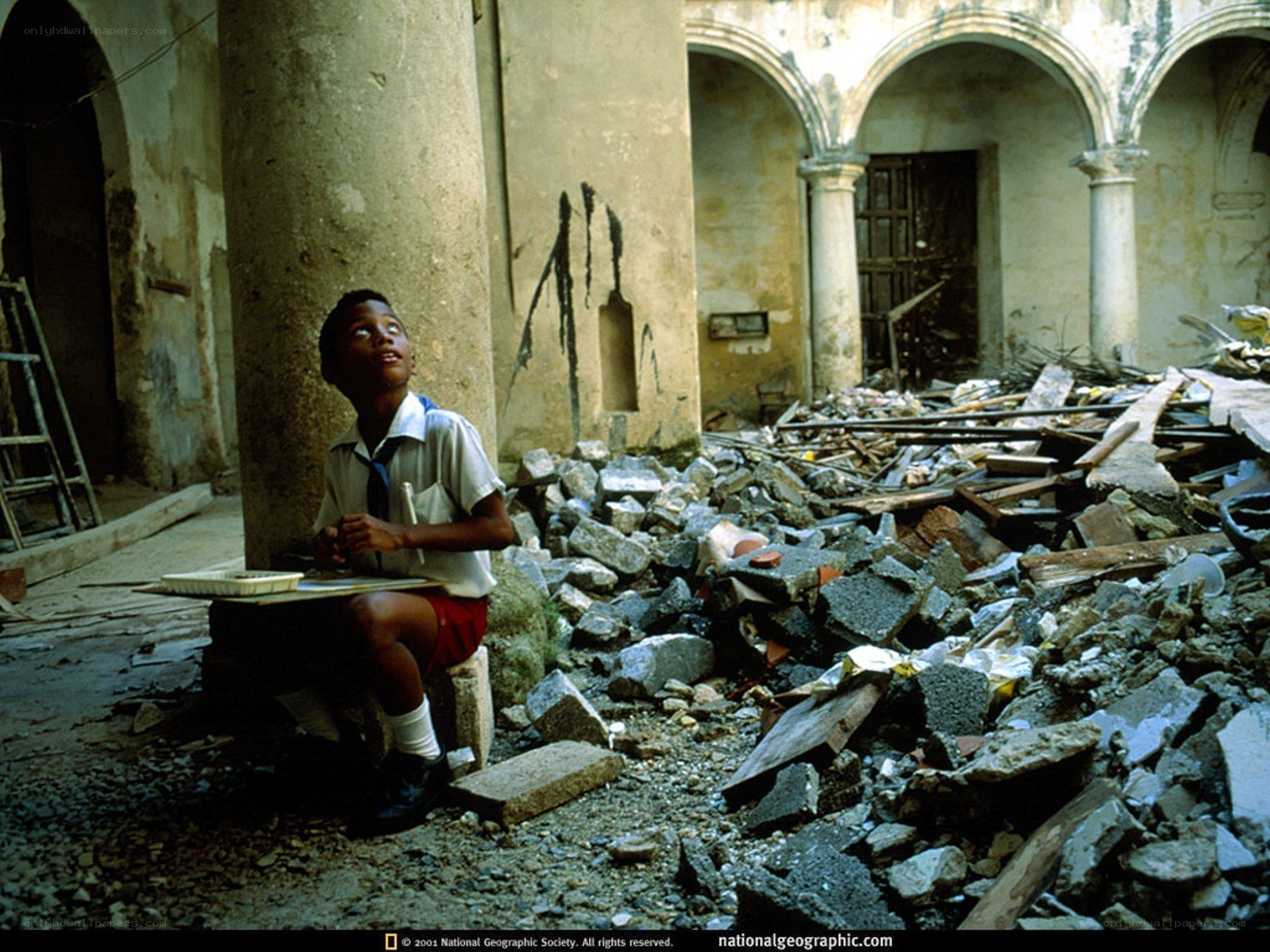 Student in a ruined courtyard