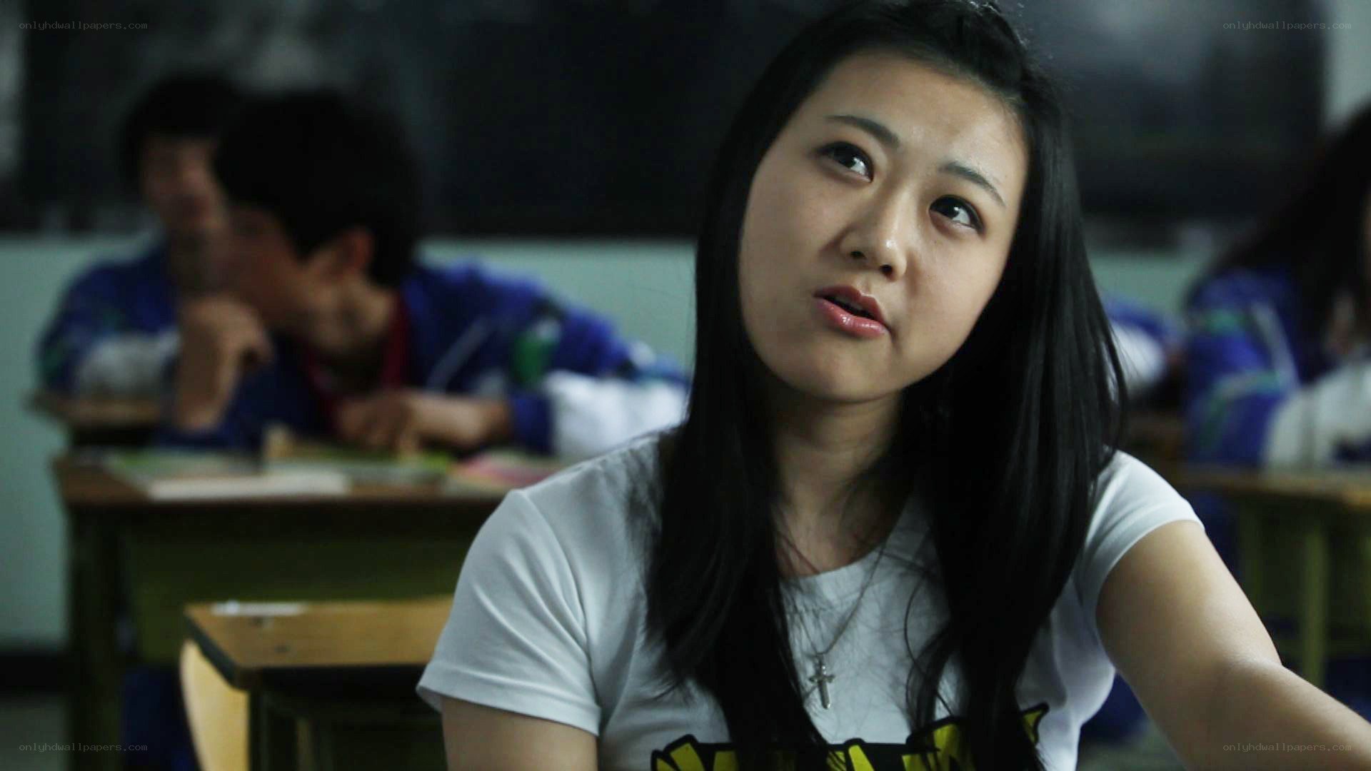 student in classroom looking up