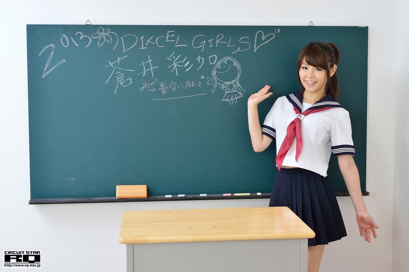 Student in classroom with chalkboard