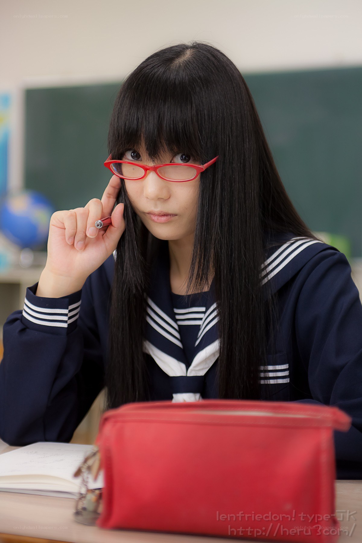 Student in classroom with red glasses