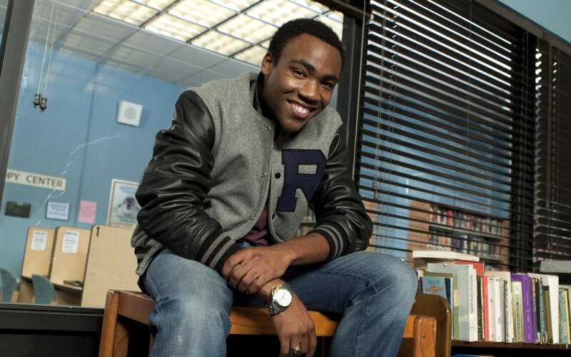 student in library smiling