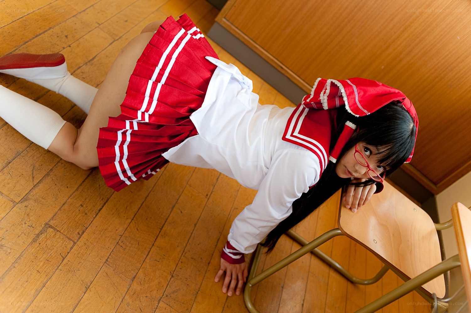 student in red and white uniform