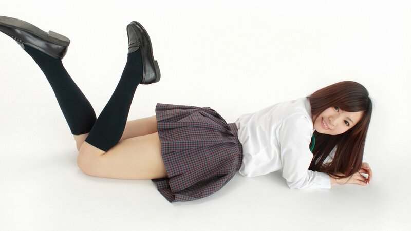 student in school uniform lying down