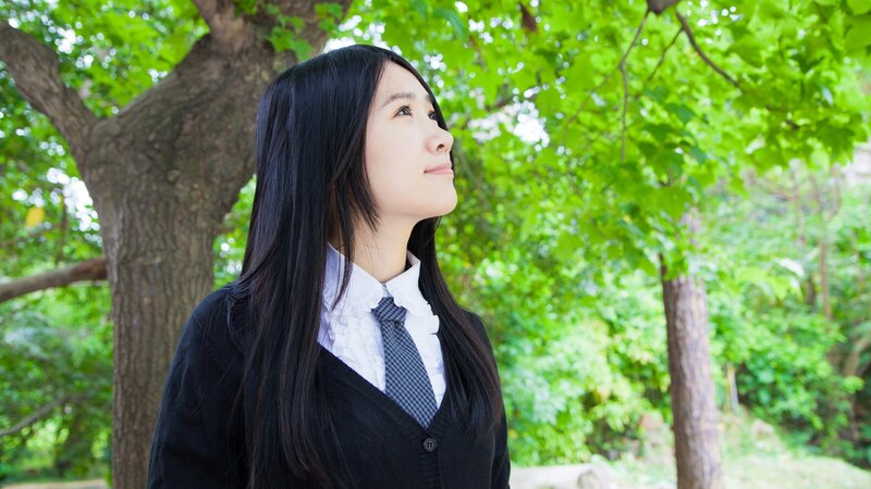 student in school uniform outdoors