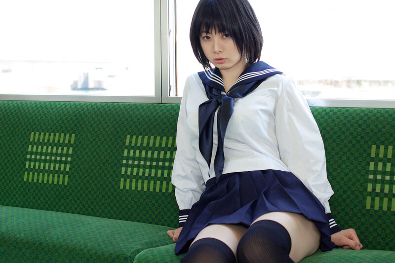 student in uniform on train