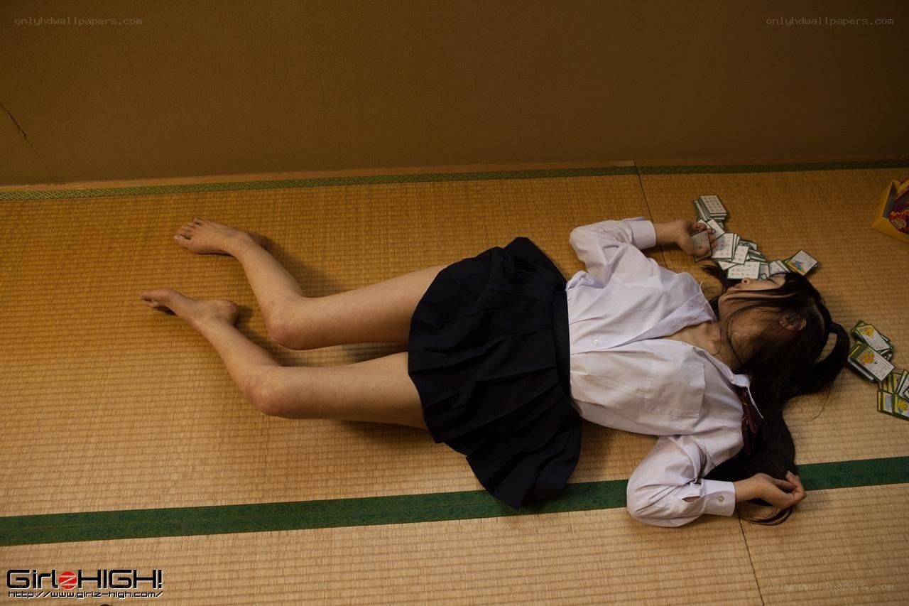 Student lying on floor with cards