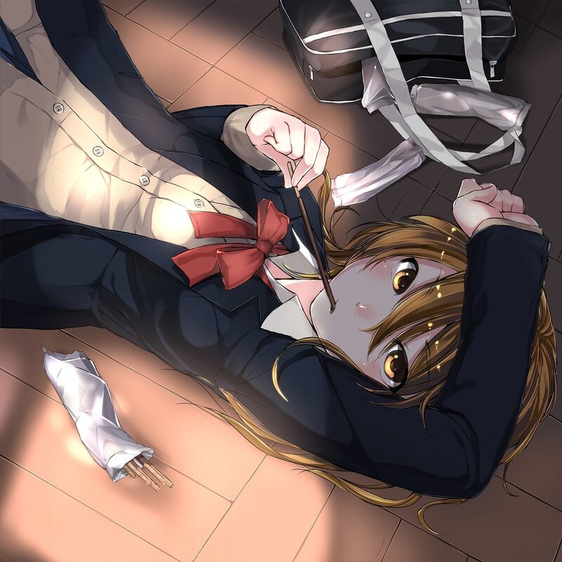 Student lying on floor with chopsticks
