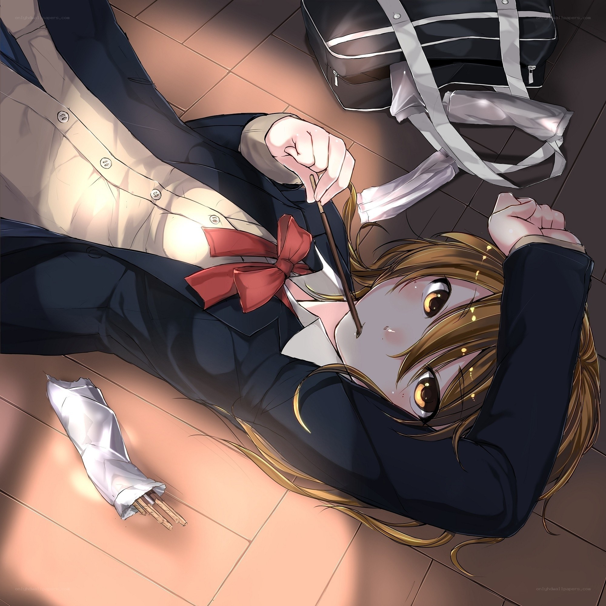 Student lying on floor with chopsticks