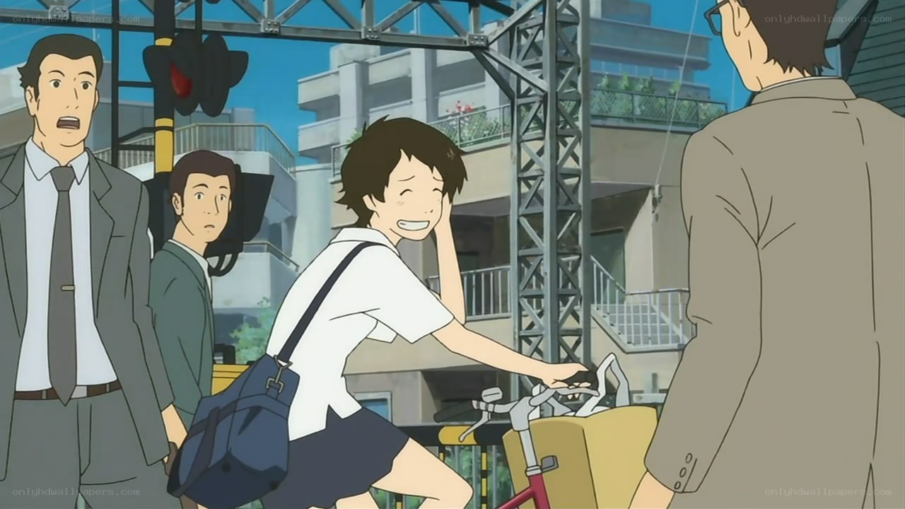 student on bicycle at train crossing