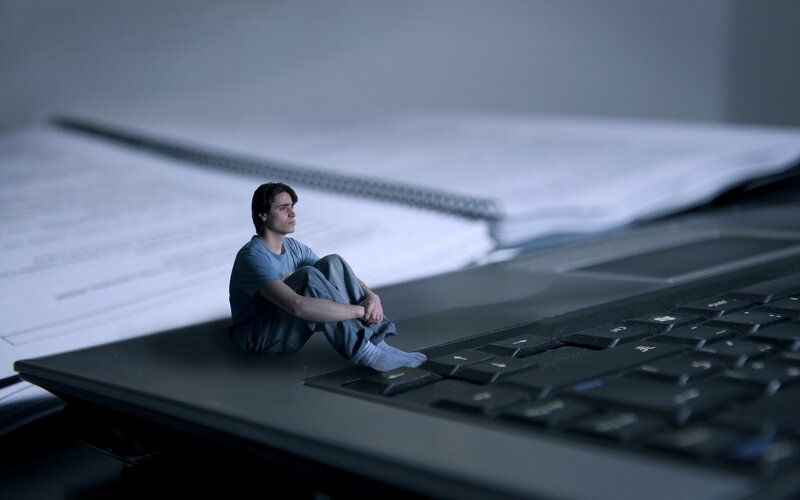 Student on laptop keyboard