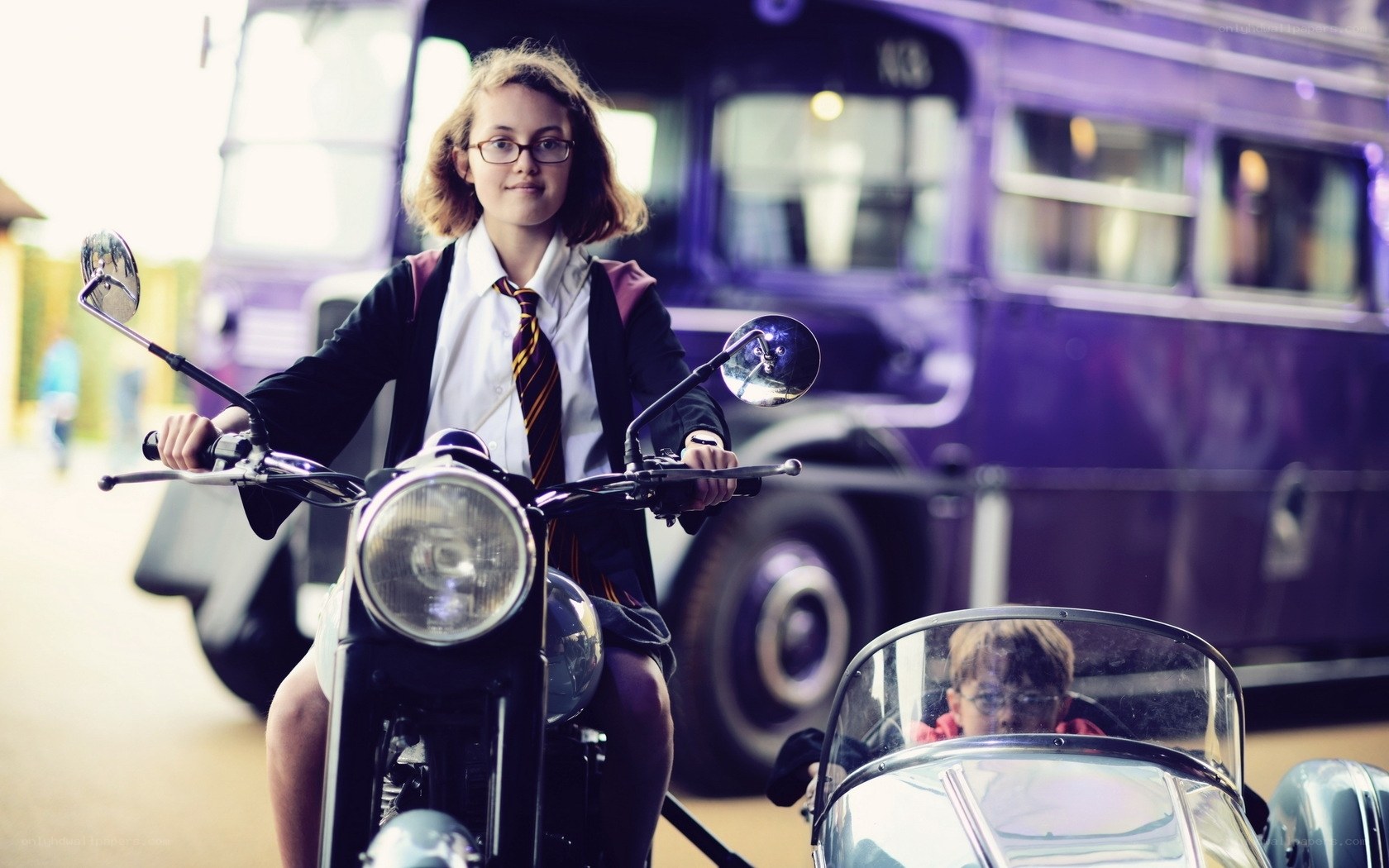 Student on motorcycle with sidecar