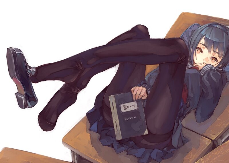 student reading on a desk