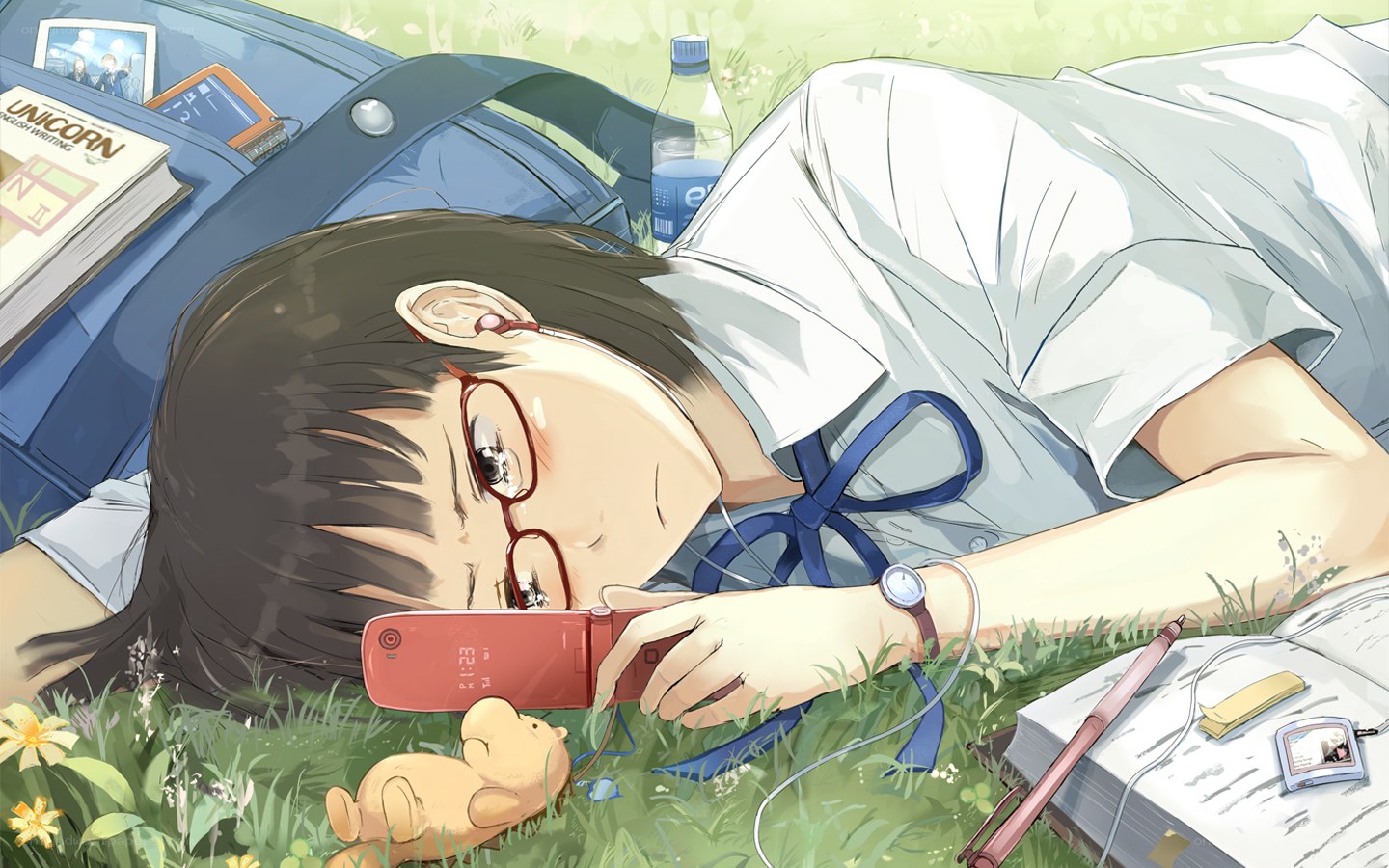 Student resting in the grass