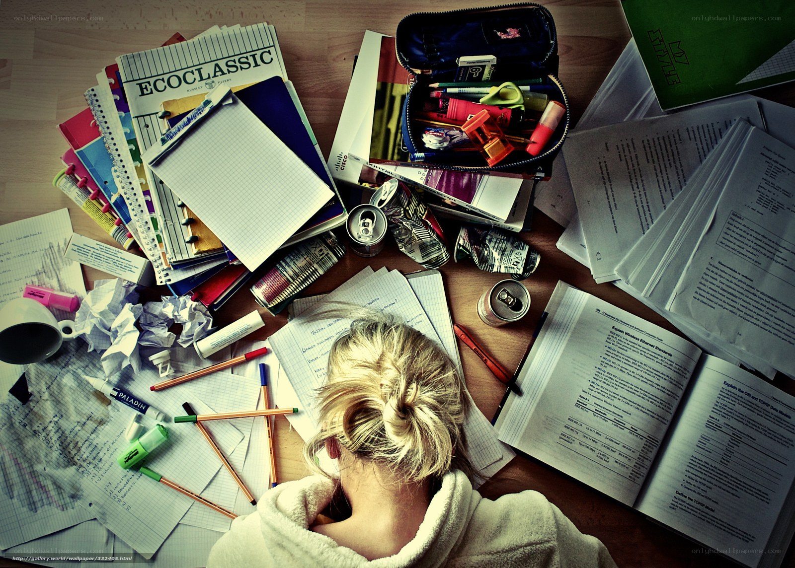 Student studying at messy desk