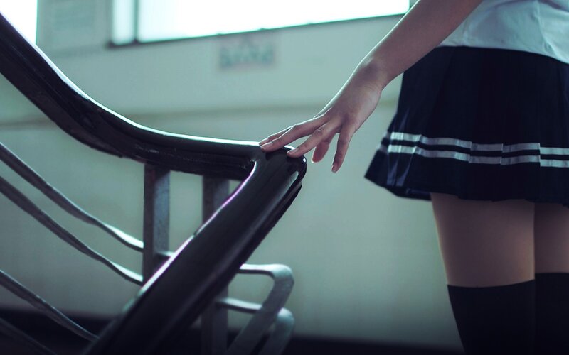 student touching handrail