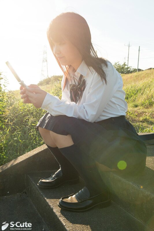 Student using phone outdoors