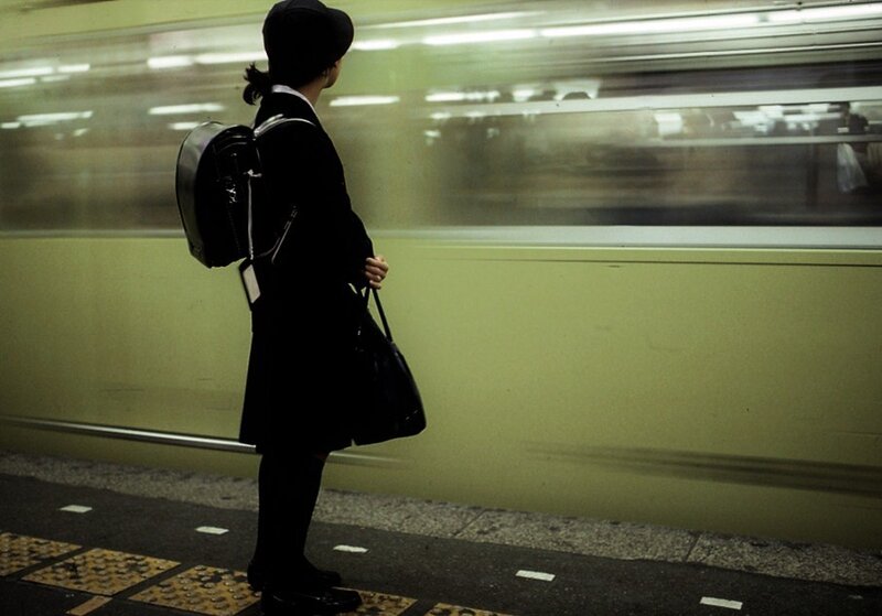 Student waiting at subway station