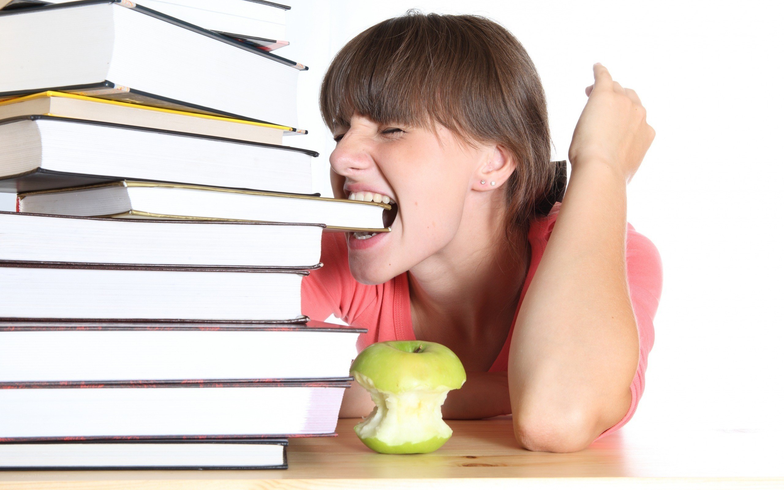 student with books and apple