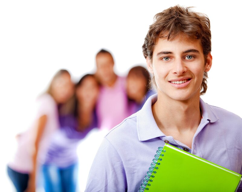 Student with notebook smiling