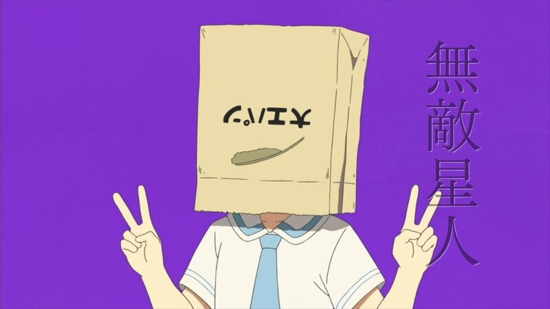 student with paper bag head