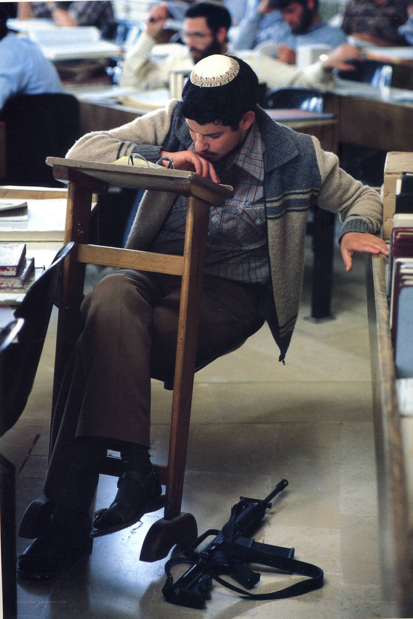 Student with rifle in classroom