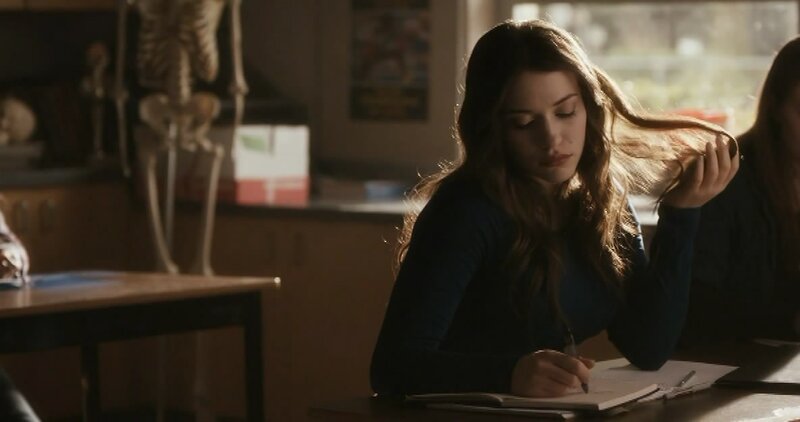 student writing in classroom