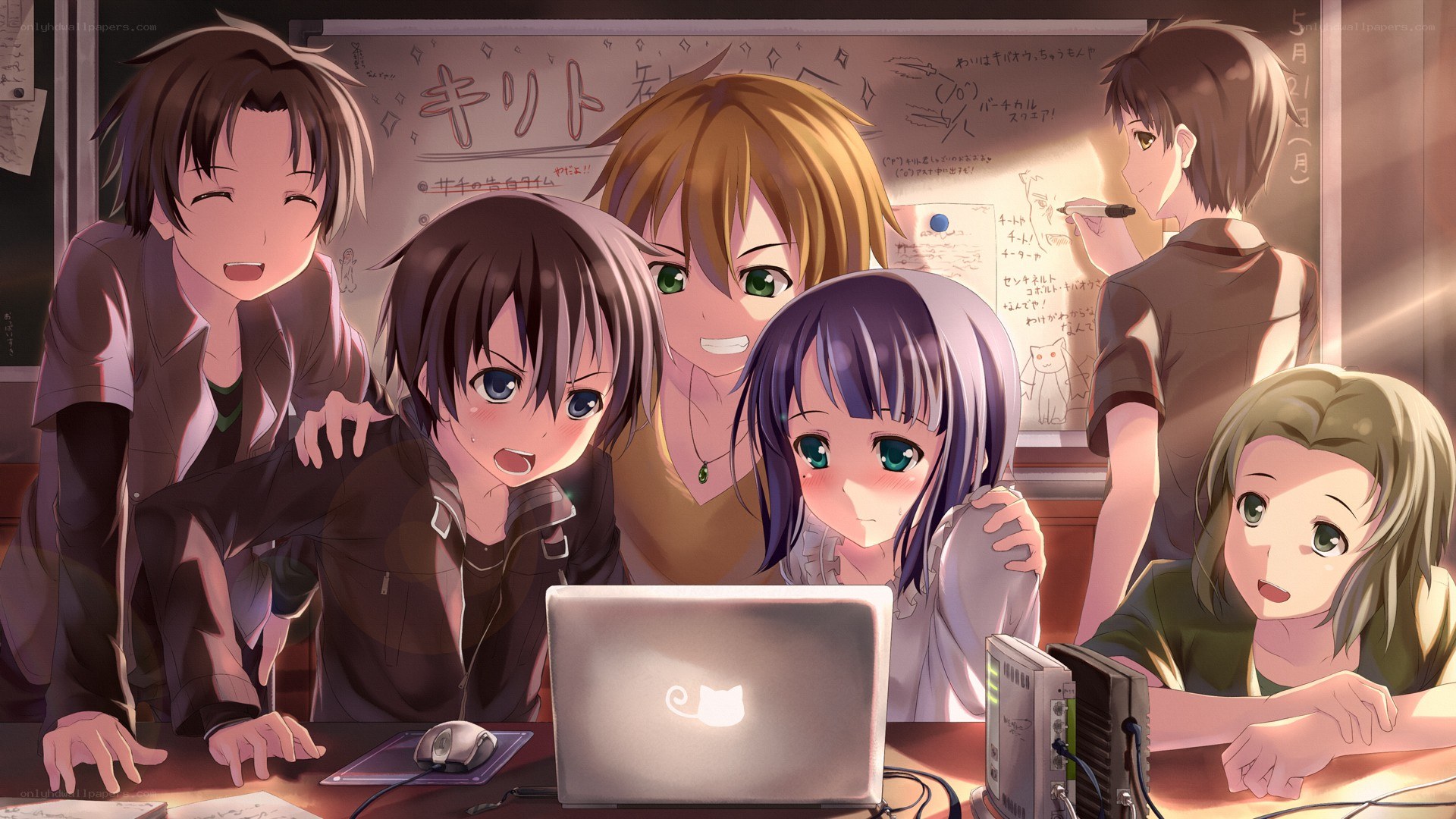Students around a laptop